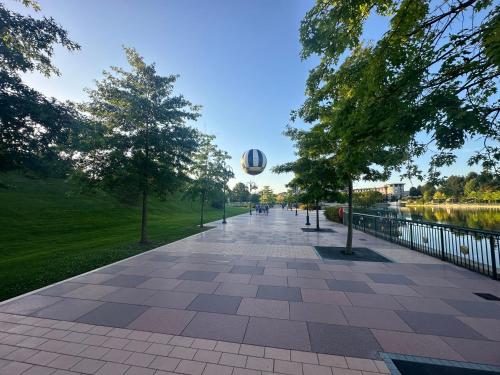 a basketball is flying through the air over a sidewalk at Immodēly & la Magie de Disney in Serris