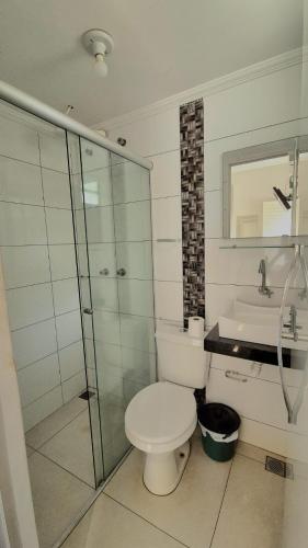 a bathroom with a toilet and a shower and a sink at GRAN HOTEL in Três Lagoas
