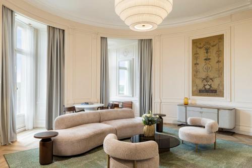 a living room with a couch and chairs at InterContinental Hotels Chantilly Chateau Mont Royal by IHG in Chantilly