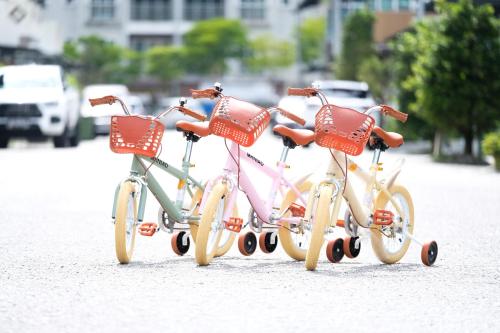 a group of three bikes parked on a street at Comfy Sofy 21- Backyard Garden- Night Market area in Cameron Highlands