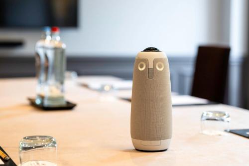 a remote control sitting on top of a table at Crowne Plaza Hotel Brugge by IHG in Bruges