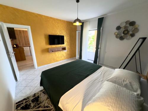 Postel nebo postele na pokoji v ubytování Apartments ASYA