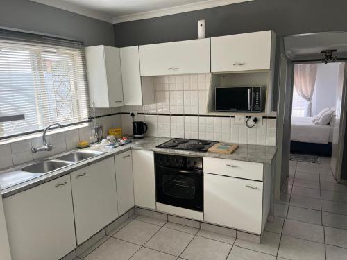 Kuchyň nebo kuchyňský kout v ubytování Eagle Apartment