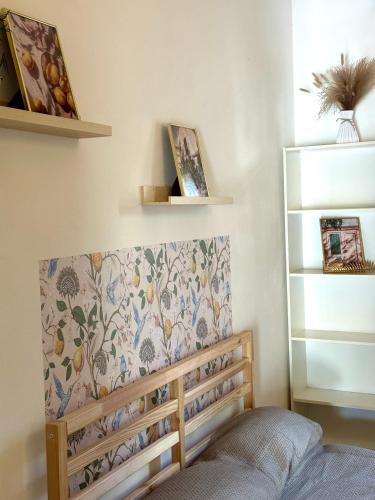 a childs bedroom with a bed and shelves at Leaning Tower Rooms Free Parking Self Check In in Pisa
