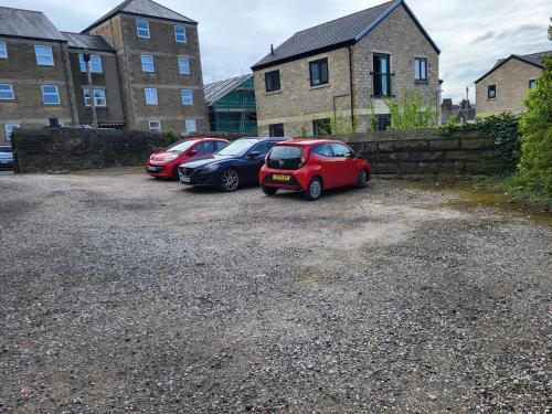 a group of cars parked in a parking lot at Station Guesthouse - key pad entry with parking in Lancaster