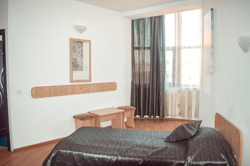 Postel nebo postele na pokoji v ubytování Pensiunea Belvedere