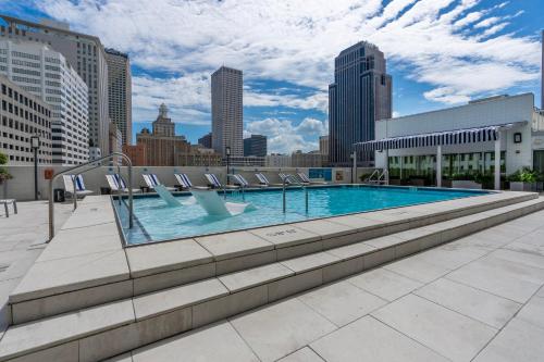 a swimming pool with a city skyline in the background at Holiday Inn New Orleans-Downtown Superdome by IHG in New Orleans