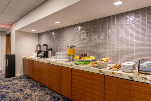 a buffet line with food on top of it at Holiday Inn New Orleans-Downtown Superdome by IHG in New Orleans