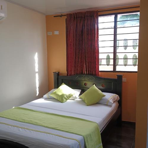 Katil atau katil-katil dalam bilik di Hotel Villa Giron inn