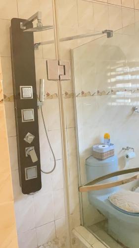 a bathroom with a shower and a toilet at Glamour C-rane lodge in Phalaborwa