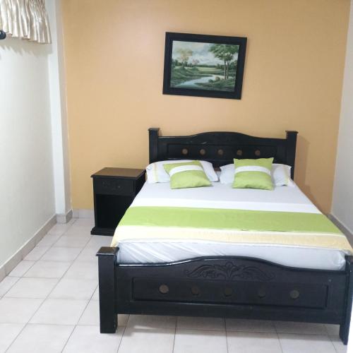 Katil atau katil-katil dalam bilik di Hotel Villa Giron inn