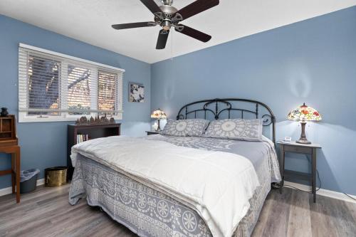 a bedroom with a bed and a ceiling fan at Laurelwood 43 with Wintergreen Advantage in Wintergreen