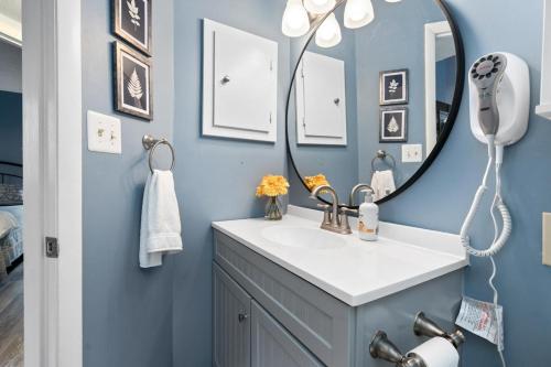a bathroom with a sink and a mirror at Laurelwood 43 with Wintergreen Advantage in Wintergreen