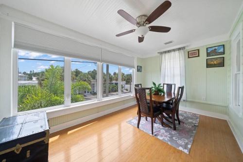 a dining room with a ceiling fan and a table at Downtown Loft with Parking - Steps to Restaurants & Nightlife in Melbourne