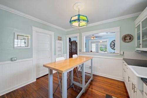 a kitchen with a table and a dining room at Downtown Loft with Parking - Steps to Restaurants & Nightlife in Melbourne