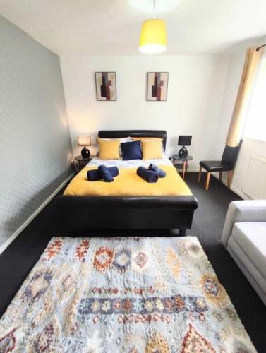 a bedroom with a bed and a rug at Entire 2 bed home, North Shields, UK FREE parking in North Tyneside
