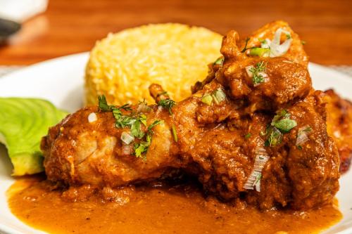 a plate of food with chicken and rice on a table at Sheraton Guayaquil in Guayaquil