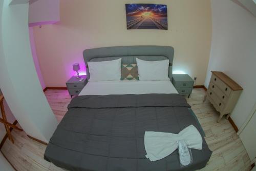 Ein Bett oder Betten in einem Zimmer der Unterkunft Lovely house in Luanda Centre