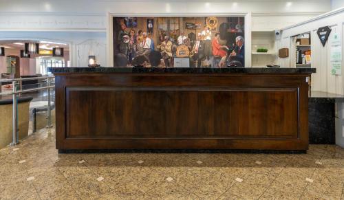 a large wooden bar in a store with a display at Holiday Inn New Orleans-Downtown Superdome by IHG in New Orleans