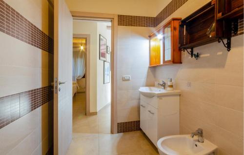 a bathroom with a sink and a toilet at 2 Bedroom Nice Home In Taranto in Taranto