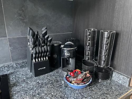 a counter with a bunch of kitchen utensils on it at Appartamenti Lago di Como in Valbrona