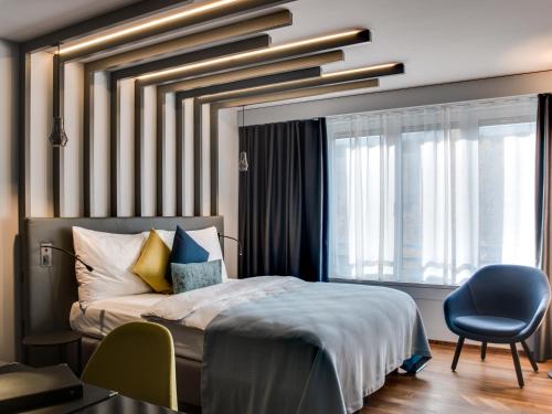 Postel nebo postele na pokoji v ubytování Park Hotel Zug