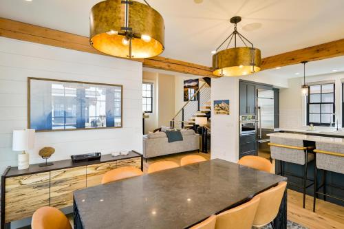 a kitchen and living room with a table and chairs at 6-Cottage Bundle at Academy Place in Crested Butte