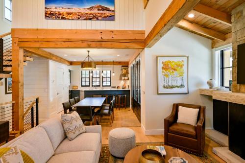 a living room with a couch and a table at 6-Cottage Bundle at Academy Place in Crested Butte