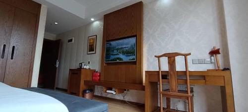 Postel nebo postele na pokoji v ubytování 恩施漫心民宿