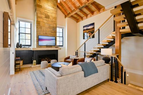 a living room with a couch and a fireplace at Academy Place | King's Crown in Crested Butte
