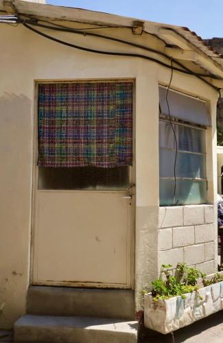 a door of a house with a curtain on it at Casa I`X in Quetzaltenango