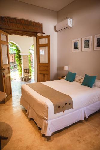 a bedroom with a large bed in a room at Vieja Posada Hotel Histórico in Cafayate