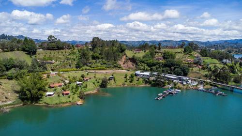 an aerial view of a lake with boats in it at Marina Navegar in Guatapé