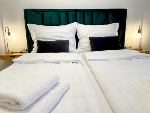 Postel nebo postele na pokoji v ubytování Apartament near RedBull Ring