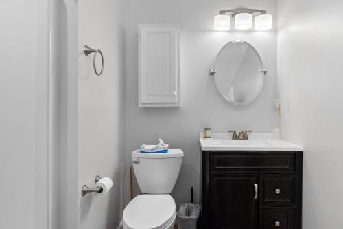 a bathroom with a toilet and a sink and a mirror at Mountain Inn Studio 92 with Wintergreen Advantage in Wintergreen