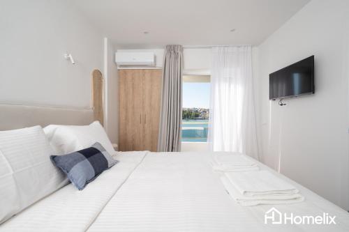 Postel nebo postele na pokoji v ubytování AMAYA - Sea View Suites