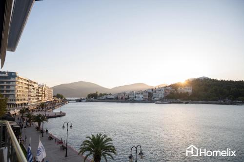a view of a large body of water with buildings at AMAYA - Sea View Suites in Chalkida