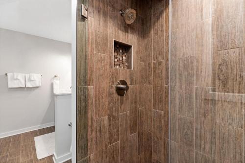 a bathroom with a shower with a glass door at Bull City Bungalow with Wintergreen Advantage in Wintergreen