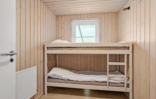 a bunk room with two bunk beds in it at 3 Bedroom Pet Friendly Home In Bryrup in Bryrup