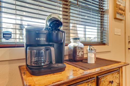 a blender sitting on top of a wooden table at Little Indian Resort Cabin Pool and Walk to Lake! in Lampe