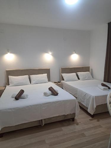 Katil atau katil-katil dalam bilik di Apartments&studio Villa Antigona