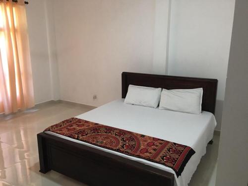 Postel nebo postele na pokoji v ubytování hancy homestay