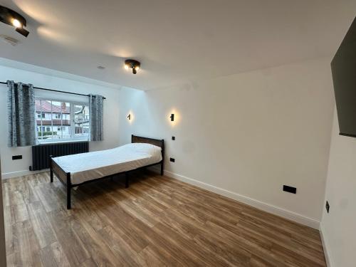 Ένα ή περισσότερα κρεβάτια σε δωμάτιο στο Roundhay Residences