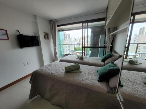 Postel nebo postele na pokoji v ubytování Lindo Studio ZN Barra