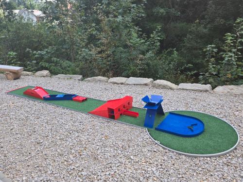 a toy skateboard on the ground in a yard at HORSKÝ PENZION U SPLAVU in Josefuv dul