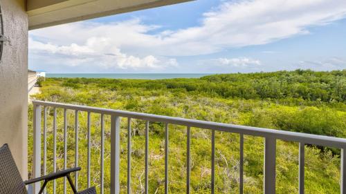 a balcony with a view of the ocean at Sea View and Sunrise Top Floor Ocean Pointe 2412 in Key Largo