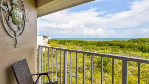 a balcony with a view of the ocean at Sea View and Sunrise Top Floor Ocean Pointe 2412 in Key Largo