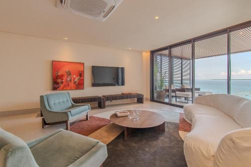 Телевизор и/или развлекательный центр в Gorges Residence Salvador