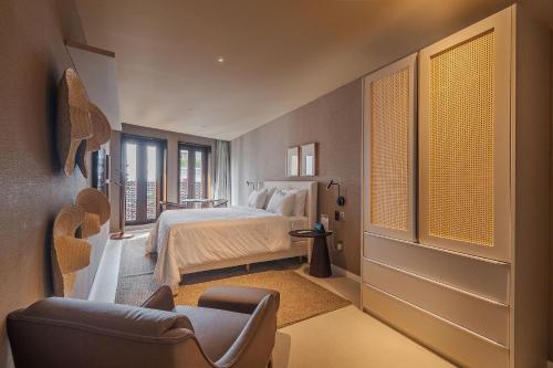Кровать или кровати в номере Gorges Residence Salvador