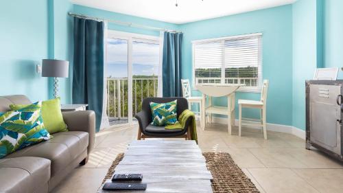 a living room with a couch and a table at Boho Chic Ocean Pointe 3214 in Key Largo